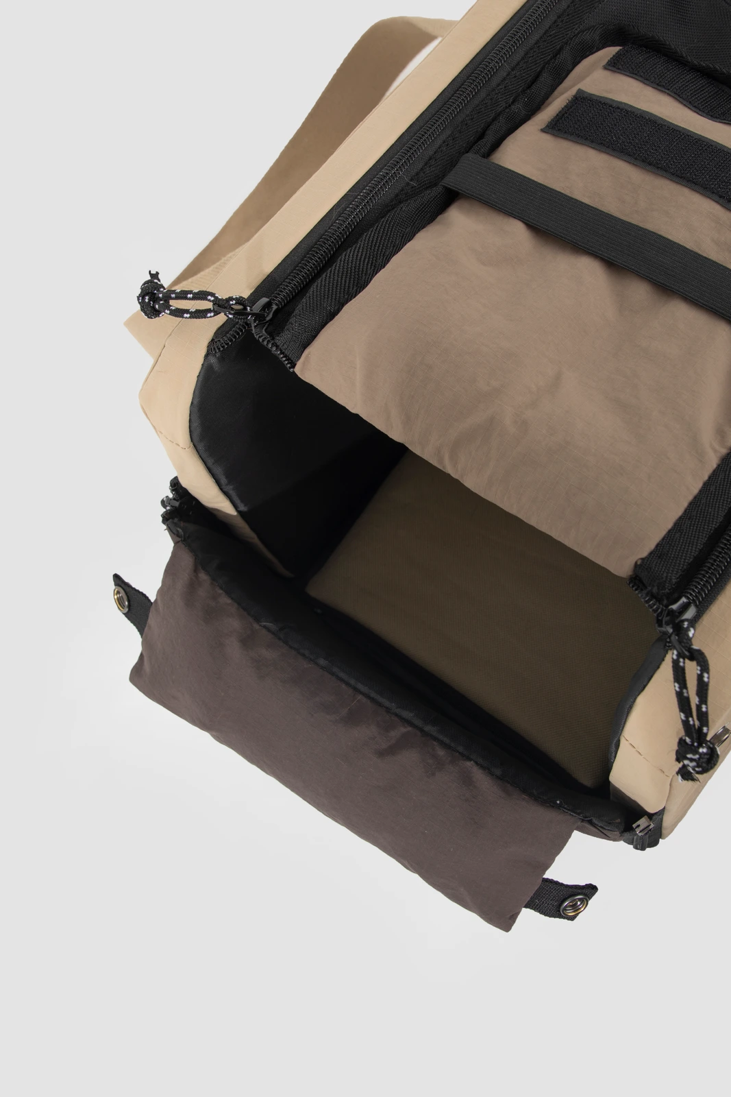 Close-up of underside zipper and strap construction