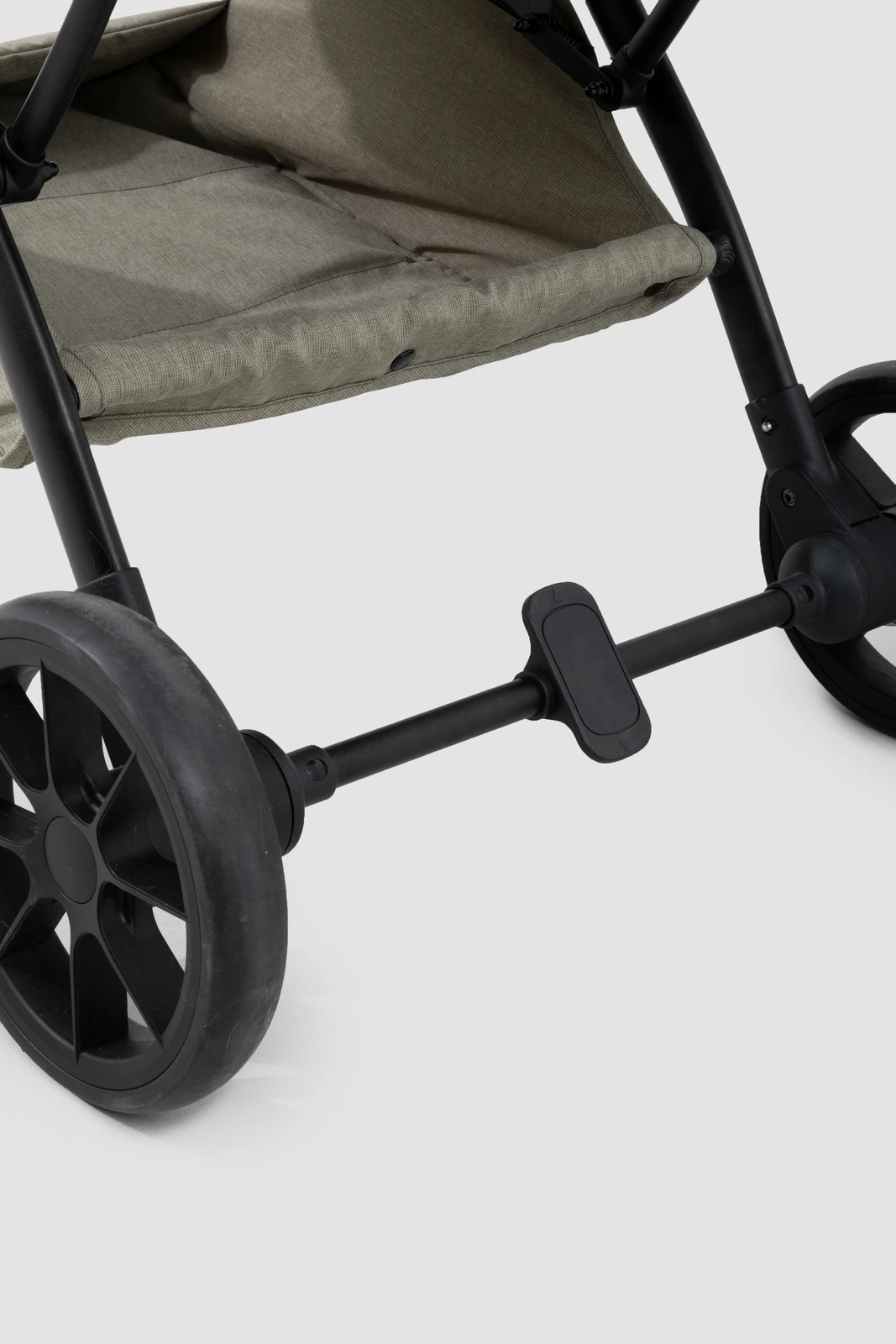 Close-up of the rear axle brake pedal and wheels