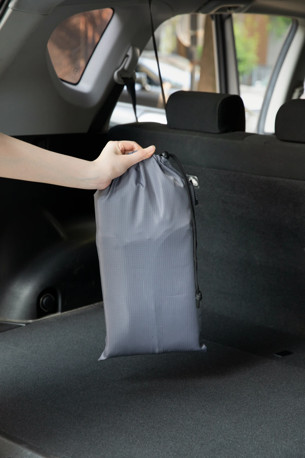 Mat packed into a compact storage pouch