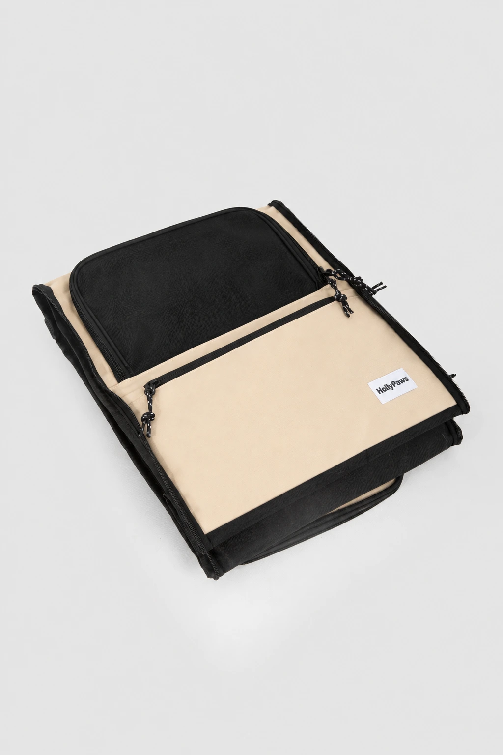Pet carrier folded flat with HollyPaws fabric label