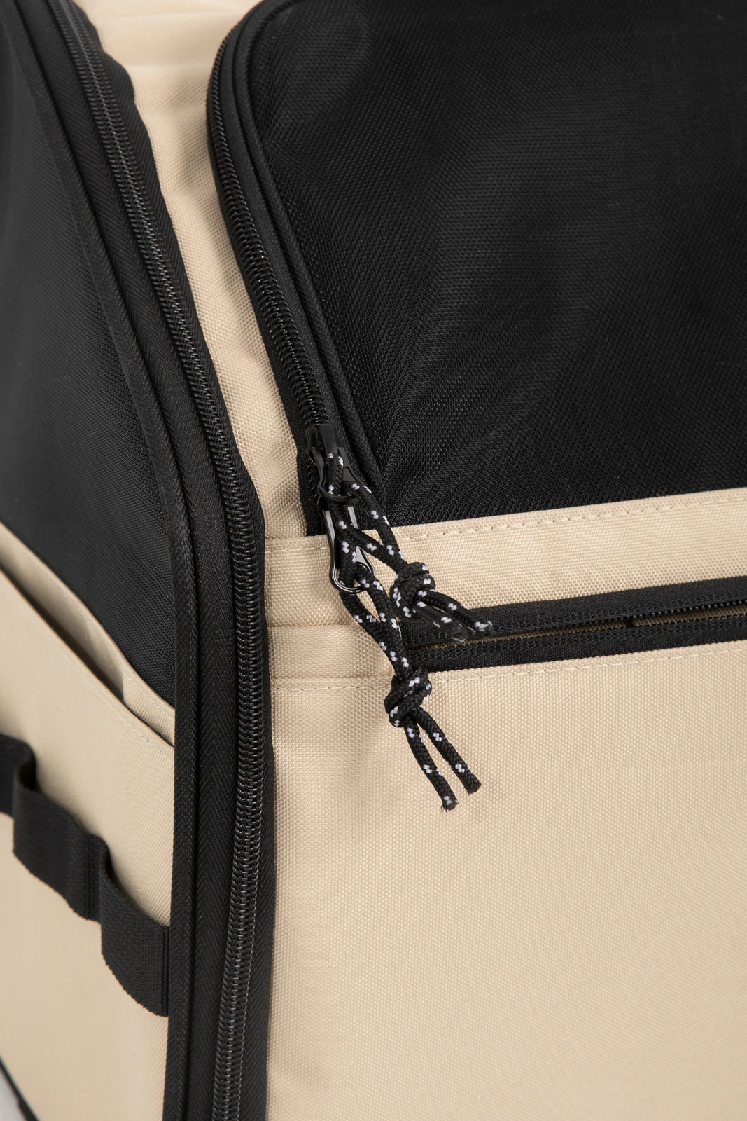 Close-up of mesh, zipper and cord pull construction