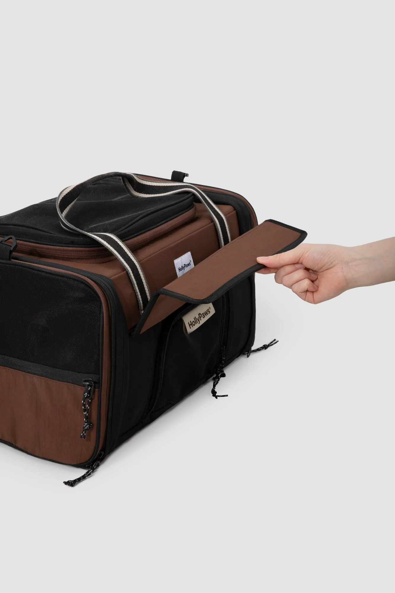 Side storage pocket opened by hand
