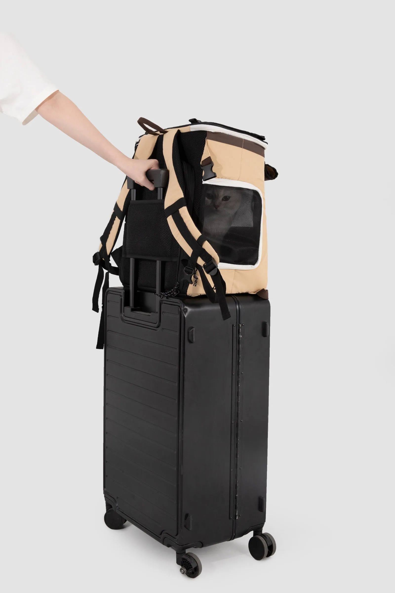 Rear sleeve fitted over a compatible suitcase handle