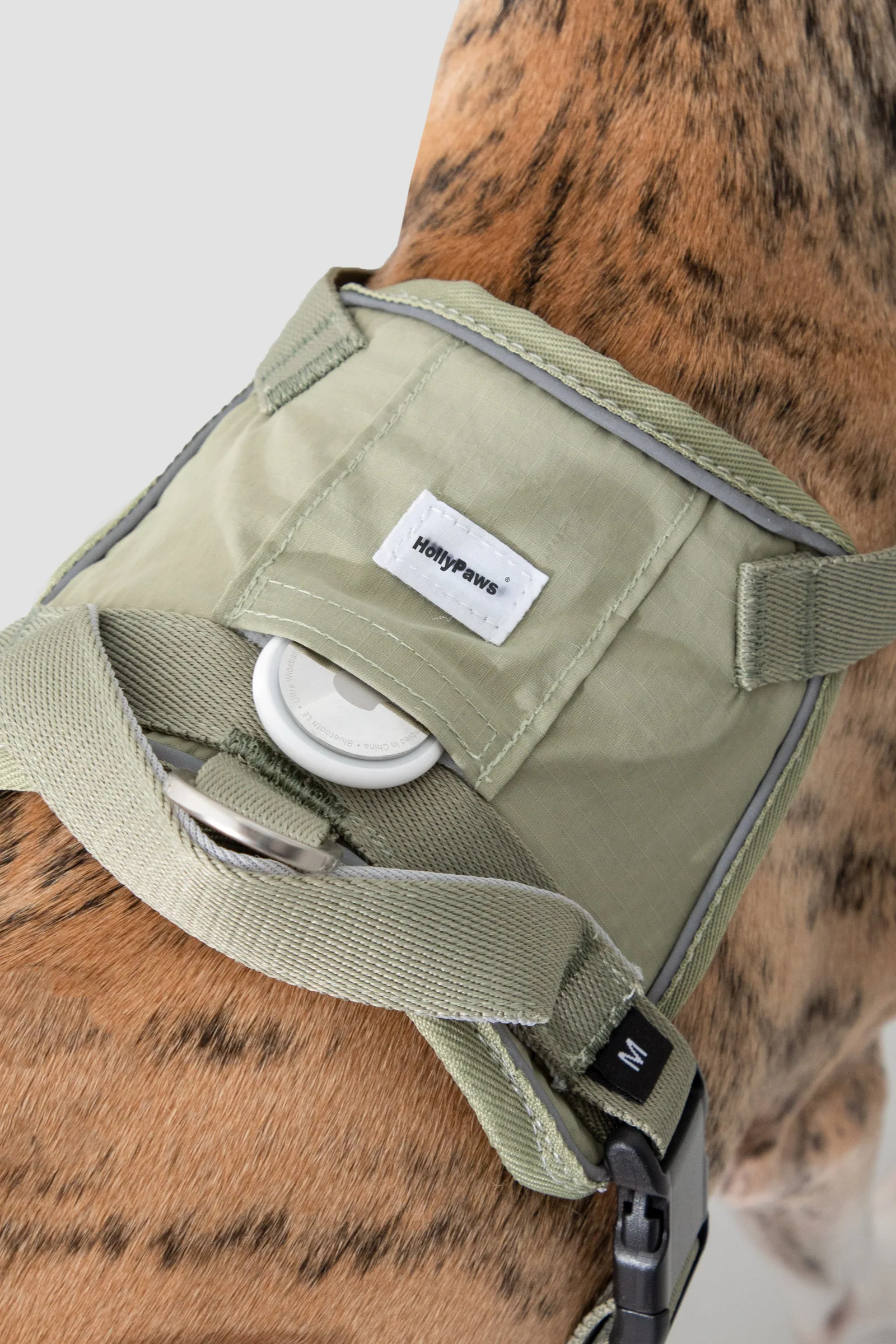 Small tracker pocket opened to show the storage position