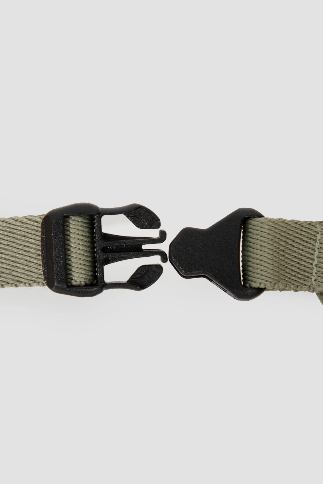 Close-up of open side-release buckle and webbing