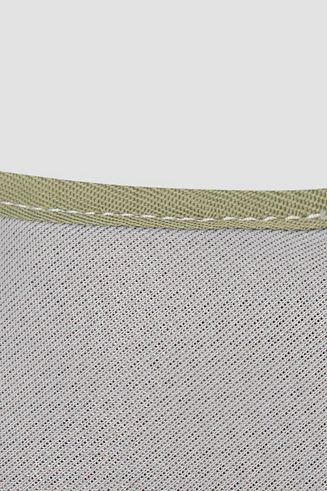 Close-up of mesh lining, edge binding and stitching